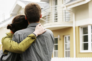 couple in front of home